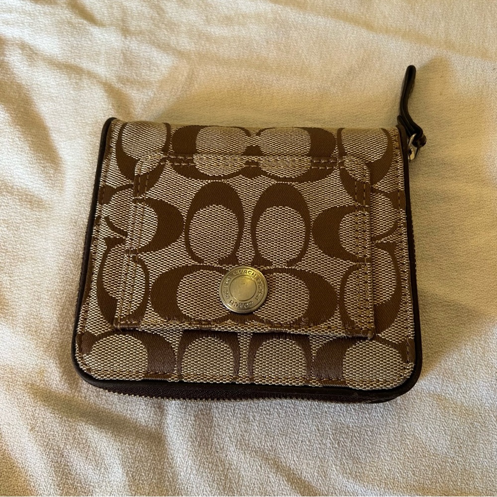 Unisex Coach creamy tan colored wallet